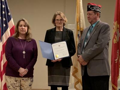 picture of Mrs. Waring receiving the VFW Educator of the Year AWard